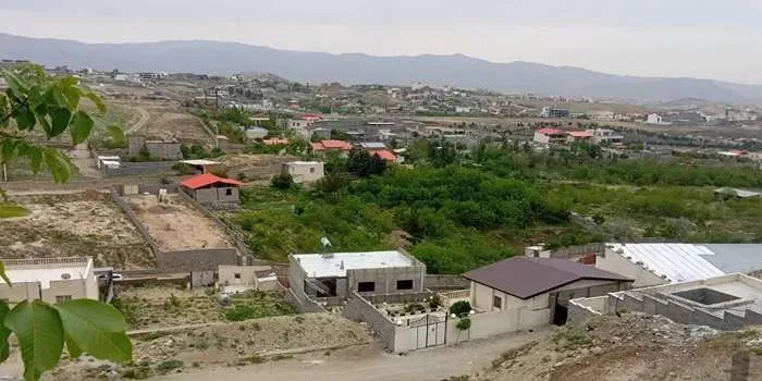 تصویری از منطقه ای سرسبز با ویلاهای زیبا در اطراف تهران